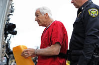BELLEFONTE, PA - OCTOBER 09: Former Penn State assistant football coach Jerry Sandusky walks into the Centre County Courthouse before being sentenced in his child sex abuse case on October 9, 2012 in Bellefonte, Pennsylvania. Sandusky faces more than 350 years in prison for his conviction in June on 45 counts of child sexual abuse, including while he was the defensive coordinator for the Penn State college football team. (Photo by Patrick Smith/Getty Images)