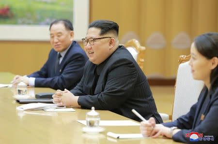 North Korean leader Kim Jong Un meets members of the special delegation of South Korea's President in this photo released by North Korea's Korean Central News Agency (KCNA) on March 6, 2018. KCNA/via Reuters