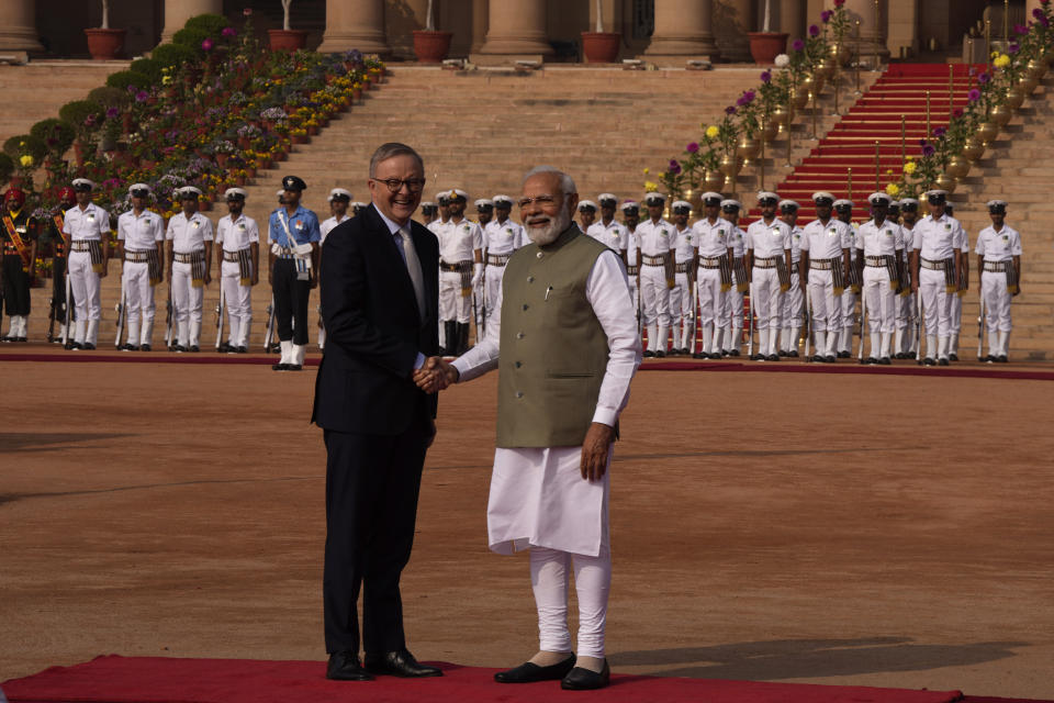 Indian Prime Minister Narendra Modi welcomes his Australian counterpart Anthony Albanese during laters's ceremonial reception at the Indian presidential palace, in New Delhi, India, Friday, March 10, 2023. Australia is striving to strengthen security cooperation with India and also deepen economic and cultural ties, Prime Minister Anthony Albanese said on Friday. (AP Photo/Manish Swarup)