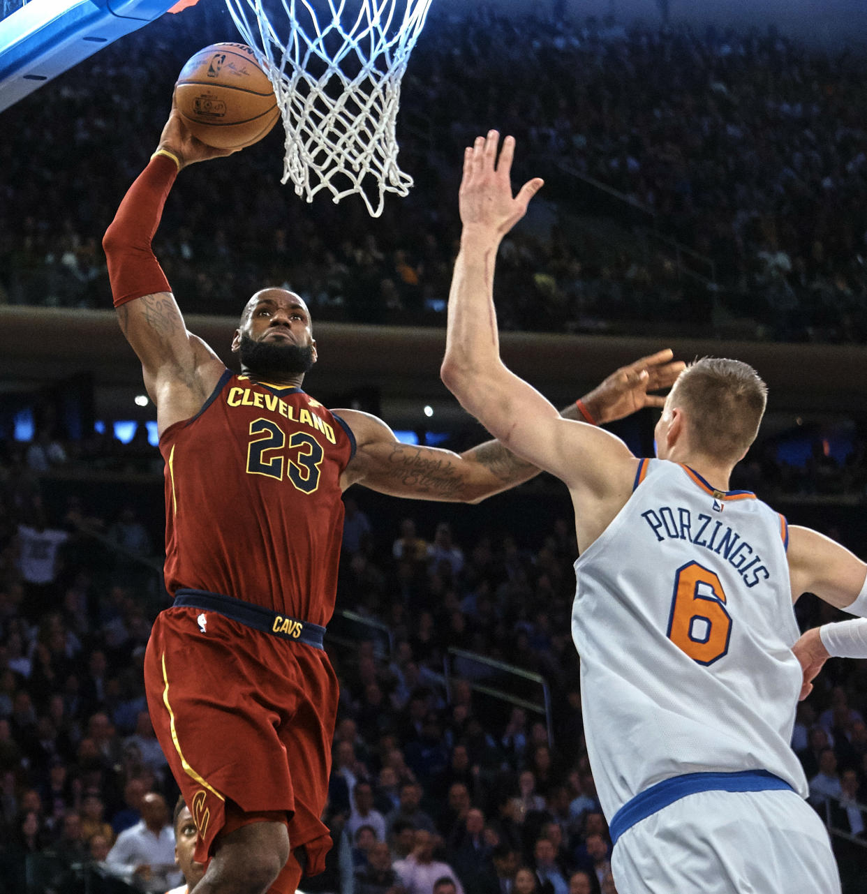 LeBron James rises to a place Kristaps Porzingis can’t quite reach yet. (AP)