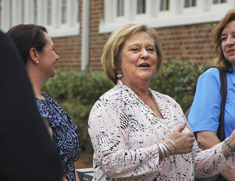 Christi Webb, executive director of Family Resource Center for Families First for Mississippi, welcomes the crowd of visitors following the ceremonial ribbon cutting at the Families First Resource Center in April 2018, in Fulton, Miss. Webb pleaded guilty Thursday, March 16, 2023, in federal court to stealing government funds intended to help needy families in one of the poorest states in the U.S. (Adam Armour/The Northeast Mississippi Daily Journal via AP)