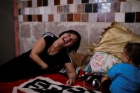 The Wider Image: Brazil women suffer in silence as COVID-19 sparks domestic terror