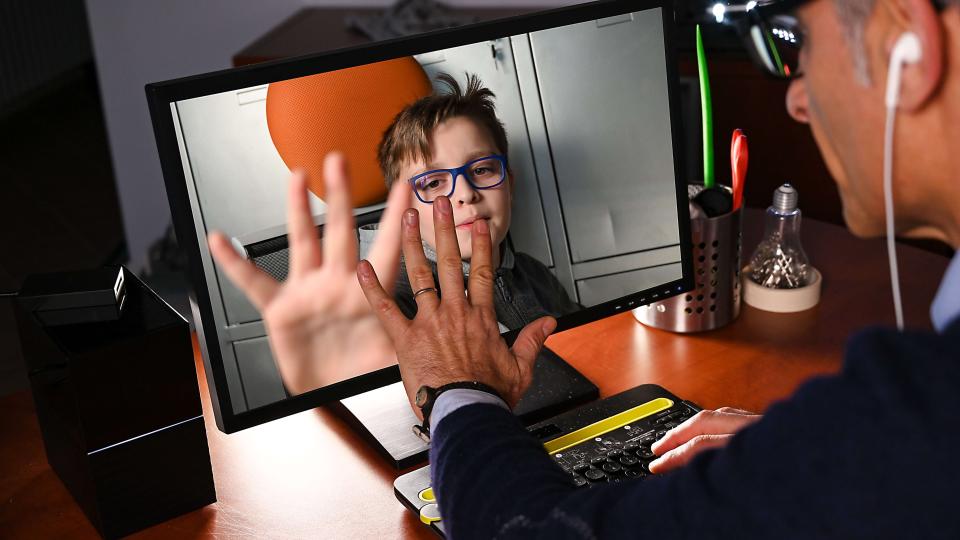 Man Video Chatting with a Child.