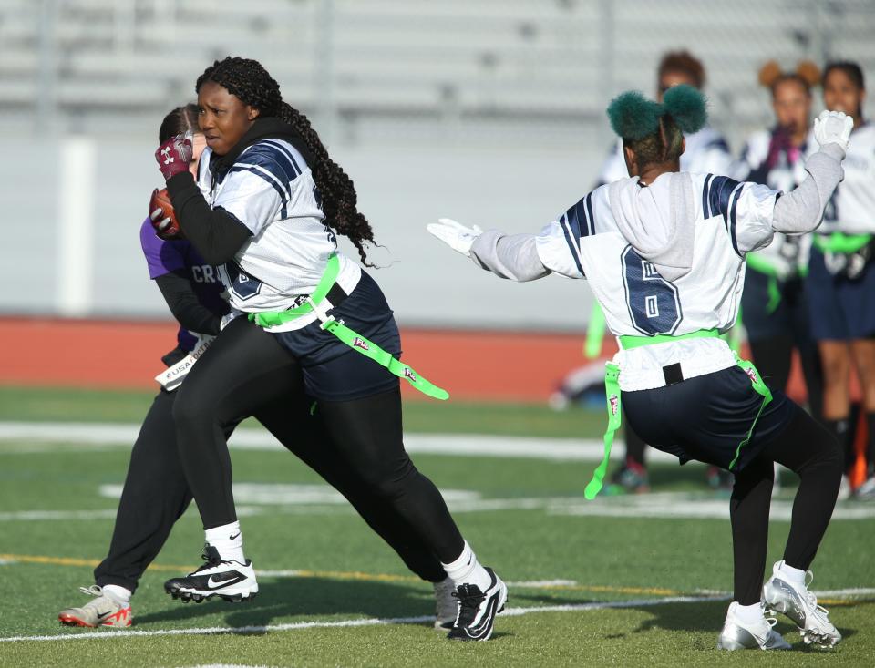 Poughkeepsie's Mahalia Samuels intercepts a pass meant for Monroe-Woodbury's Kelly Imhof during a game on April 4, 2024.