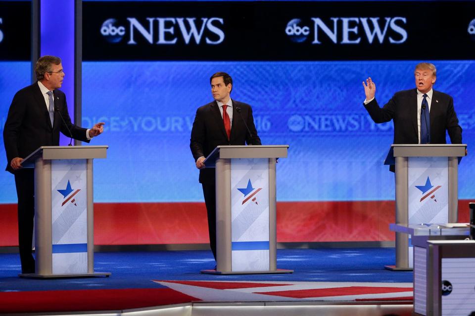 Republican presidential candidate, former Florida Gov. Jeb Bush  and Republican presidential candidate, businessman Donald Trump spar as Republican presidential candidate, Sen. Marco Rubio, R-Fla.,  listens in the middle during a Republican presidential primary debate hosted by ABC News at the St. Anselm College  Saturday, Feb. 6, 2016, in Manchester, N.H.