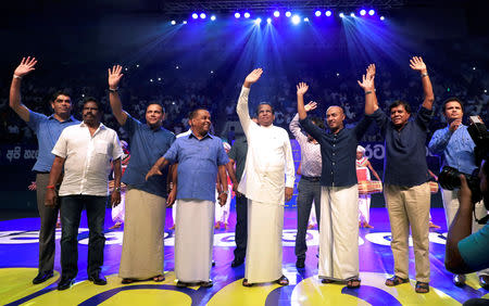 Sri Lanka's President Maithripala Sirisena waves at his supporters, together with his party members, during a special party convention in Colombo, Sri Lanka December 4, 2018. REUTERS/Dinuka Liyanawatte