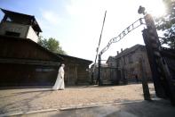 Pope Francis cuts a solitary figure as he enters the former Nazi German Auschwitz-Birkenau death camp on July 29, 2016