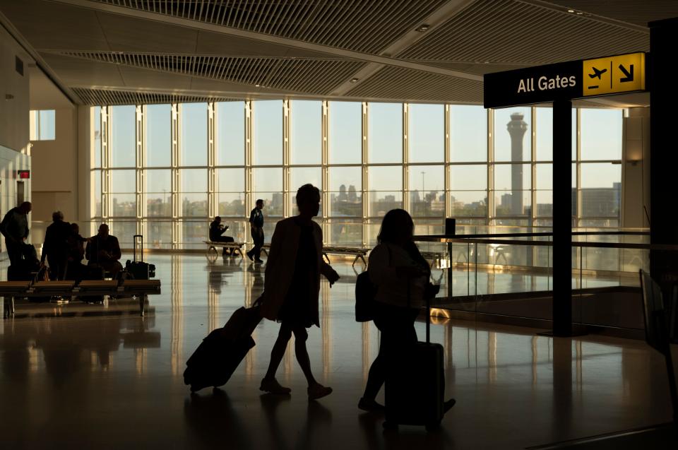 Travelers pass through Terminal A of Newark Liberty International Airport on Sunday, May 7, 2023, in Newark, N.J.