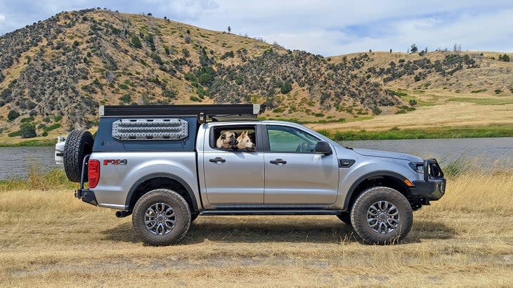 <span class="article__caption">Bowie and Teddy in my current Ford Ranger (I’ve owned two). In addition to the stuff listed below, I also <a href="https://www.outsideonline.com/outdoor-gear/cars-trucks/truck-dogs-safety-comfort/?utm_campaign=discover_rss&utm_source=yahoo&utm_medium=OUTSIDE" rel="nofollow noopener" target="_blank" data-ylk="slk:replaced the rear seat with a plate system to add more space for the dogs;elm:context_link;itc:0;sec:content-canvas" class="link ">replaced the rear seat with a plate system to add more space for the dogs</a>. </span> (Photo: Wes Siler)