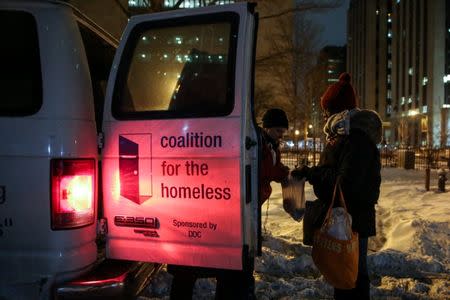 New York City's Coalition for the Homeless delivers food, donated clothing and supplies to homeless people as part of their weekly distribution during winter storm Grayson in Manhattan, New York City, U.S., January 4, 2018. REUTERS/Amr Alfiky