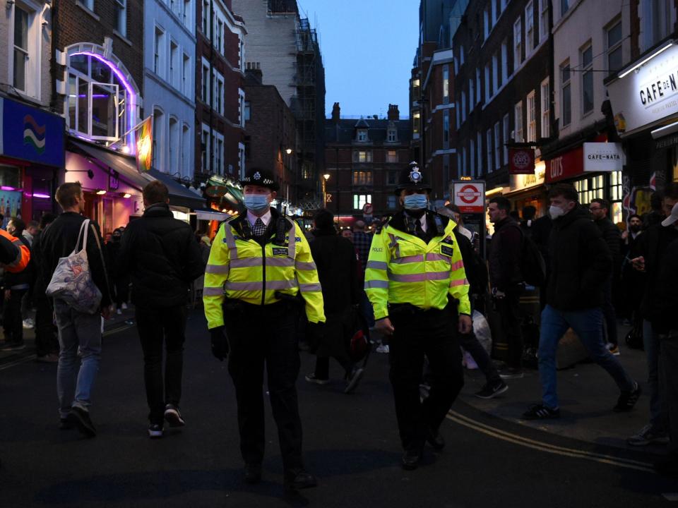 Police Officers in central London, on the first Friday evening after pubs in England were allowed to reopen to serve customers outside (PA)