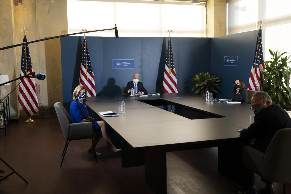 President-elect Joe Biden, speaks during a meeting with Vice President-elect Kamala Harris, right, Senate Minority Leader Chuck Schumer of N.Y., and House Speaker Nancy Pelosi of Calif., left, Friday, Nov. 20, 2020, in Wilmington, Del. (AP Photo/Alex Brandon)