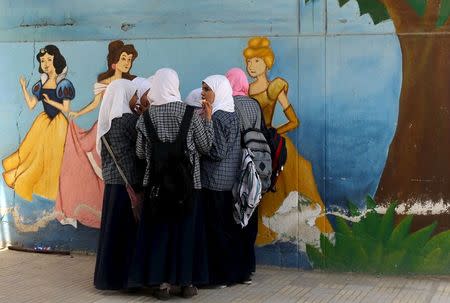 Students talk after finishing an exam in one of the Al-Azhar institutes in Cairo, Egypt, May 20, 2015. REUTERS/Asmaa Waguih