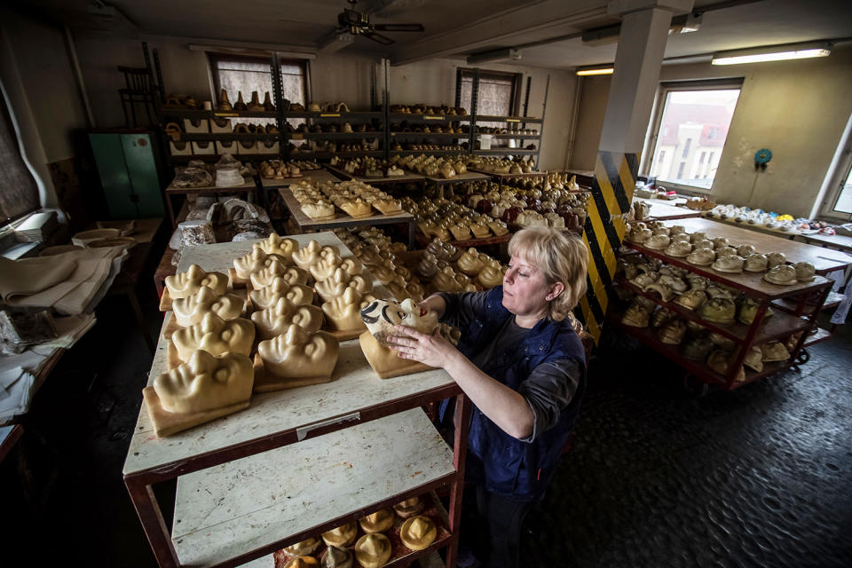 <p>A worker prepares a cast for carnival masks at the PVO company in Zakupy, Czech Republic, Feb. 24, 2017. According to owner Zdenek Rydygr, PVO is the last company in Europe that produces paper carnival masks by traditional procedure. The others stopped their production due to the import of cheap Chinese goods made from plastic. (Photo: Martin Divisek/EPA) </p>