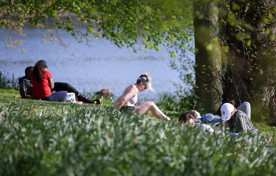 LONDON, ENGLAND - APRIL 10: Sunbathers in Regents Park, Good Friday on April 10, 2020 in London. There have been around 70,000 reported cases of the COVID-19 coronavirus in the United Kingdom and over 7,000 deaths. The country is in its third week of lockdown measures aimed at slowing the spread of the virus. (Photo by Jo Hale/Getty Images)