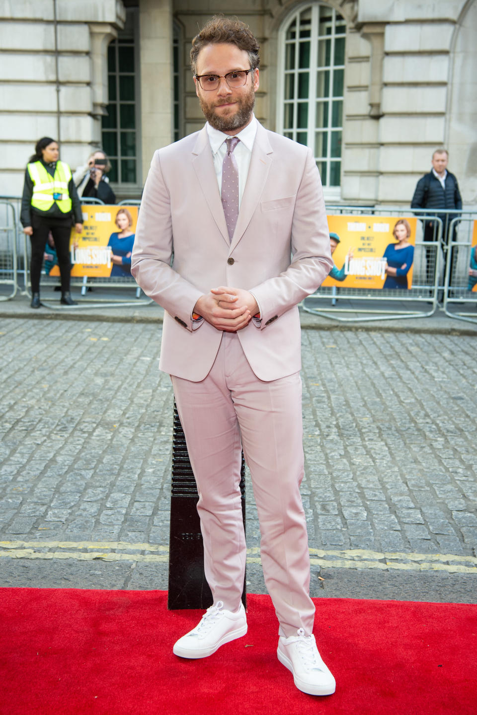 <p>The actor turned director wore a pink Paul Smith suit on the red carpet at the Curzon Mayfair, London. <em>[Photo: PA]</em> </p>