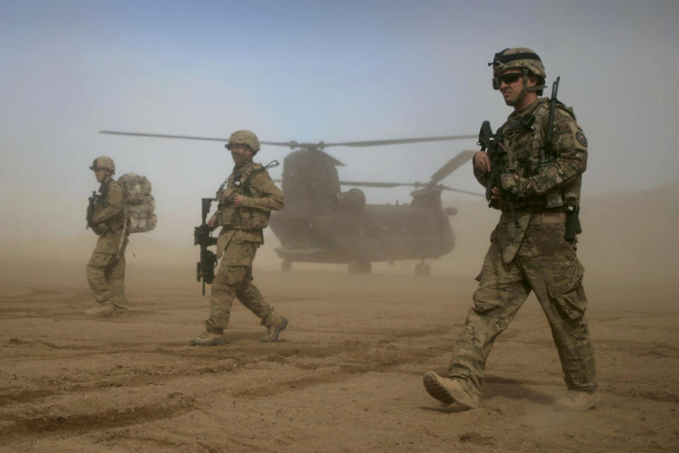 FILE - In this Jan. 28, 2012 file photo, U.S. soldiers, part of the NATO- led International Security Assistance Force (ISAF) patrol west of Kabul, Afghanistan. As the United States ends the nearly 20-year war in Afghanistan and as the Taliban recapture much of the country, Americans are asking if the longest war in their history was worth the cost. (AP Photo/Hoshang Hashimi, File)