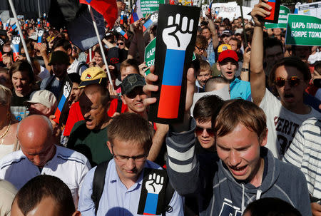 People attend a protest over the government's decision to increase retirement age in Moscow, Russia, July 29, 2018. REUTERS/Sergei Karpukhin