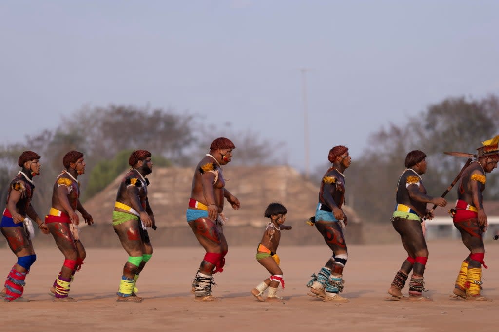 Mabitchuri, a Yawalapiti child, takes part in an ‘end of mourning dance’  (Reuters)