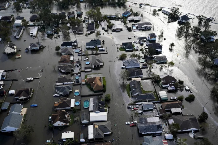 Homes are flooded in the aftermath of Hurricane Ida, Monday, Aug. 30, 2021, in Jean Lafitte, La. (AP Photo/David J. Phillip)