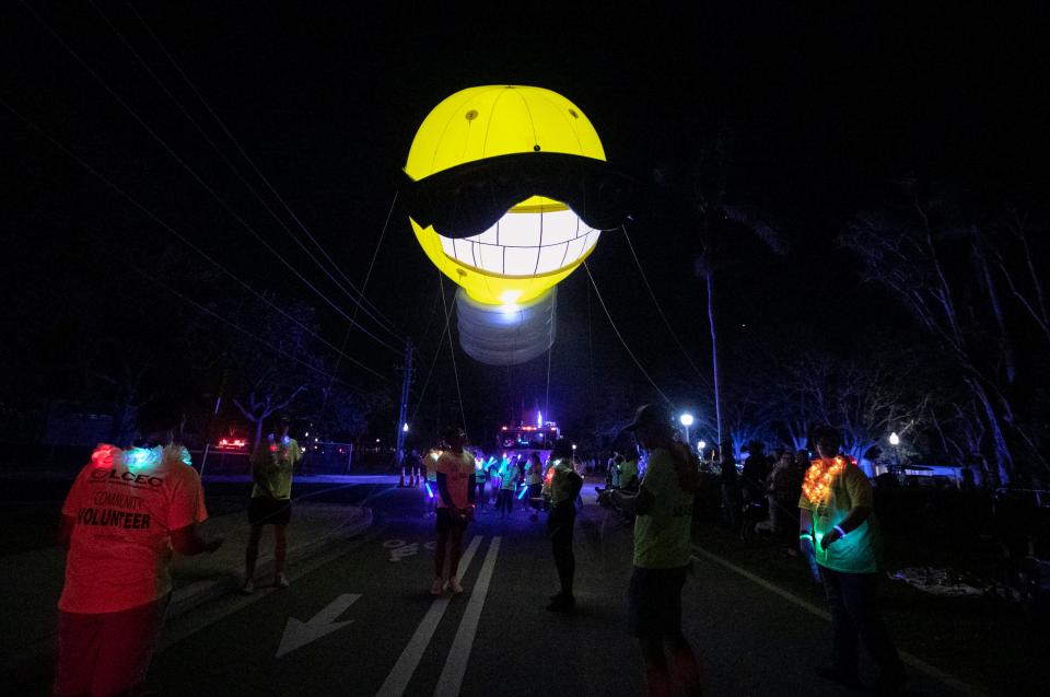 The LCEC lightbulb balloon travels down Cortez Boulevard during the Edison Festival of Light Parade on Saturday, Feb. 18, 2023, in Fort Myers.