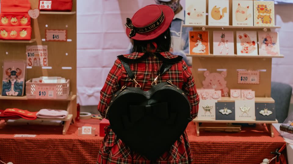A Lolita woman shops during the annual Bay Area J-Fashion Holiday Pop-Up Shop at the Hotel Kabuki in San Francisco, California, on Dec 3, 2022. Lolitas from across California attended the event to purchase all their Lolita needs from local vendors. - Shelby Knowles