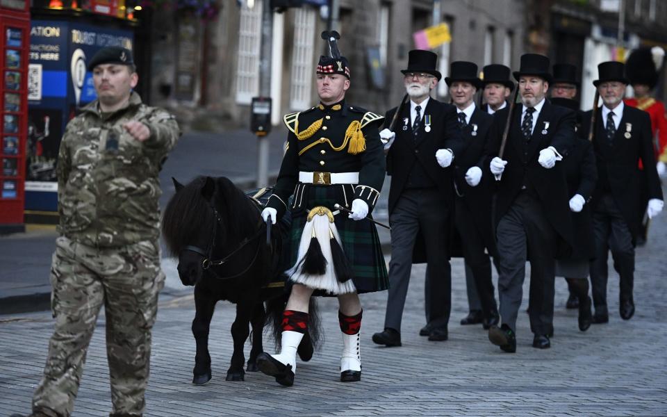 An early morning procession rehearsal takes place along the Royal Mile in Edinburgh, ahead of King Charles III's Service of Thanksgiving