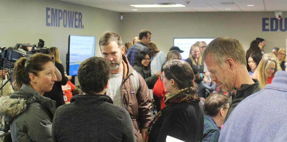 Parents and other concerned citizens talk after the public speaking portion of the Jan. 23, 2024, board meeting of the Monroe County Community School Corp.