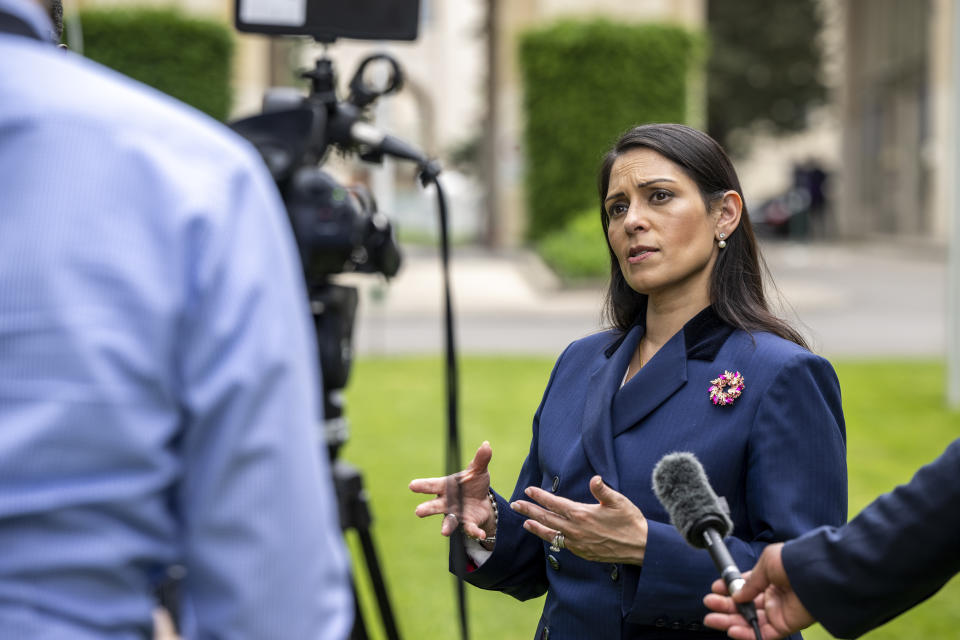 Britain's Home Secretary Priti Patel speaks during an interview with the Associated Press at the European headquarters of the United Nations in Geneva, Switzerland, Thursday, May 19, 2022. (Martial Trezzini/Keystone via AP)