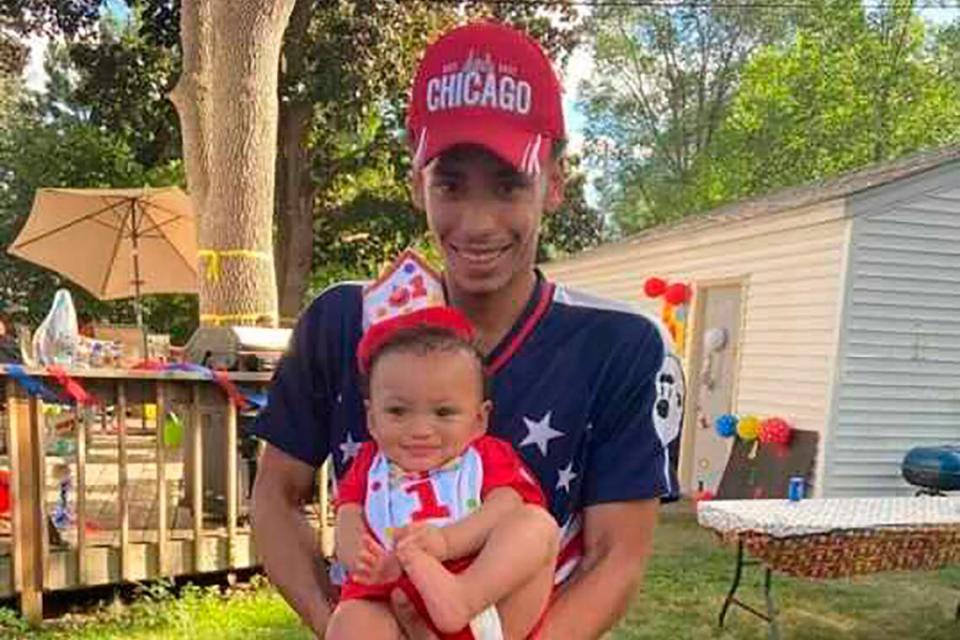 FILE - This photo provided by Ben Crump Law, PLLC. shows Daunte Wright and his son, Daunte Jr., at his first birthday party. Wright, 20, was killed during a traffic stop by a white suburban Minneapolis police officer on Sunday, April 11, 2021. (Ben Crump Law, PLLC. via AP)