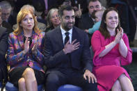 Scottish National Party leader candidates Ash Regan, left, and Kate Forbes applaud as Humza Yousaf, center is announced new SNP leader, at Murrayfield Stadium, in Edinburgh, Scotland, Monday, March 27, 2023. Scotland’s governing Scottish National Party elected Yousaf as its new leader on Monday after a bruising five-week contest that exposed deep fractures within the pro-independence movement. The 37-year-old son of South Asian immigrants is set to become the first person of color to serve as Scotland’s first minister. (Andrew Milligan/PA via AP)