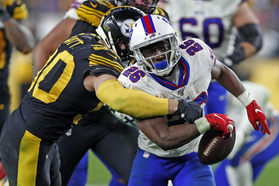 Pittsburgh Steelers outside linebacker T.J. Watt (90) strips the ball from Buffalo Bills running back Devin Singletary (26) and the Steelers recovered during the second half of an NFL football game in Pittsburgh, Sunday, Dec. 15, 2019. (AP Photo/Keith Srakocic)