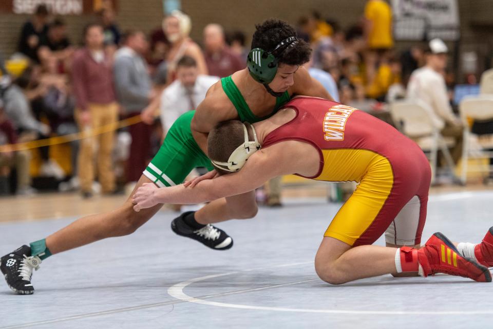 Mater Dei’s Caleb Schaefer and Vincennes Lincoln’s Donta Henderson compete in the 113-pound championship match of the 2024 IHSAA Wrestling Sectional tournament at Central High School in Evansville, Ind., Saturday afternoon, Jan. 27, 2024.
