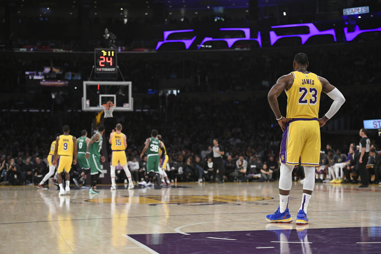 LOS ANGELES, CA - MARCH 09: LeBron James #23 stands in the backcourt as Moritz Wagner #15 of the Los Angeles Lakers shoots freethrows agaisnt the Boston Celtics at Staples Center on March 9, 2019 in Los Angeles, California. Celtics won 120-107.  NOTE TO USER: User expressly acknowledges and agrees that, by downloading and or using this photograph, User is consenting to the terms and conditions of the Getty Images License Agreement. (Photo by John McCoy/Getty Images)