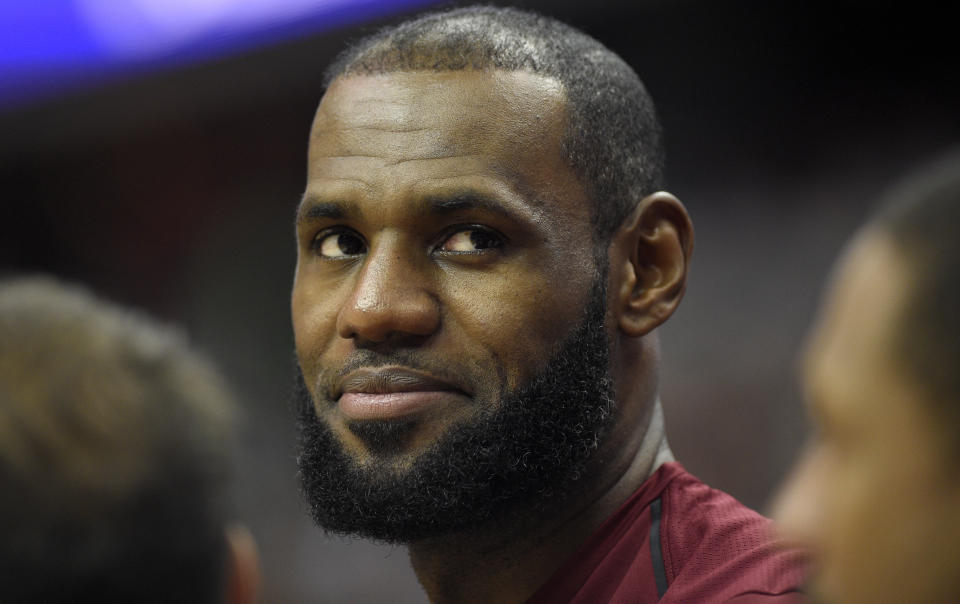 LeBron James keeps his smile as tight as his wallet. (AP)