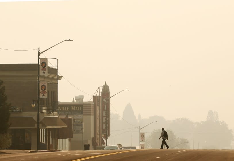 JANESVILLE, CALIF. - AUG. 18, 2021. A pall of yellow smoke from the Dixie blankets the town of Susanville, Calif., on Friday, Aug. 20, 2021. The wildfire has burned more than 1,100 square miles, destroyed 659 homes and is only about 30 percent contained. (Luis Sinco / Los Angeles Times)