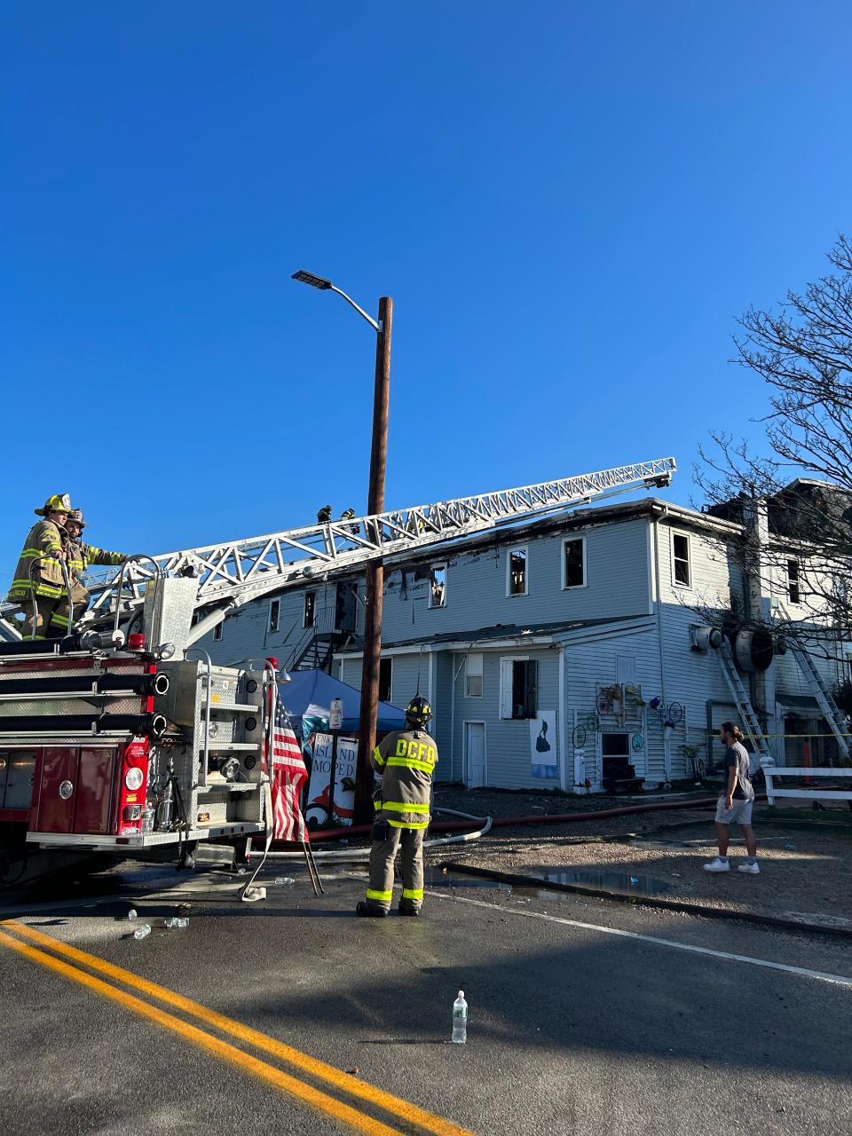 Fire crews working at the Harborside in in New Shoreham on Block Island where a massive fire broke out Friday night. Power is out on the island and visitors are asked to not travel to the island Saturday.