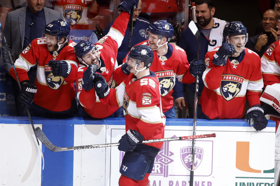 Florida Panthers' Noel Acciari (55) celebrates with teammates after scoring a goal on a penalty shot during the second period of an NHL hockey game against the Dallas Stars, Friday, Dec. 20, 2019, in Sunrise, Fla. (AP Photo/Luis M. Alvarez)