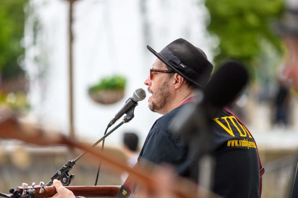 Lead singer Dave Van Dyke of the Van Dyke Revue entertains the audience at the Fridays by the Fountain event in South Bend.