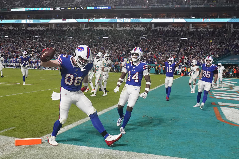 Buffalo Bills tight end Dawson Knox (88) celebrates after scoring a touchdown during the second half of an NFL football game against the Miami Dolphins, Sunday, Jan. 7, 2024, in Miami Gardens, Fla. (AP Photo/Wilfredo Lee )