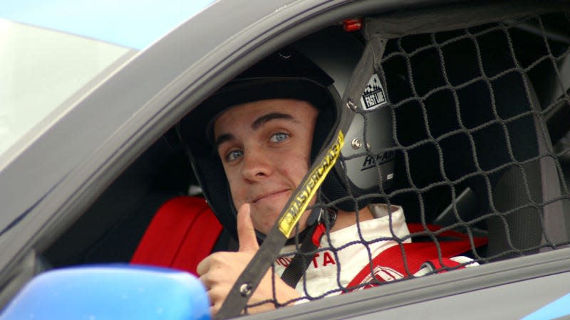 A photo of Frankie Muniz in a racing car in 2004 