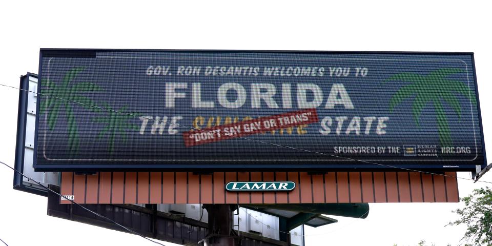 A billboard that says "Florida: The 'Don't Say Gay or Trans' State."