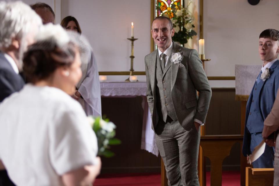 <p>Zak walks Lydia down the aisle. </p>