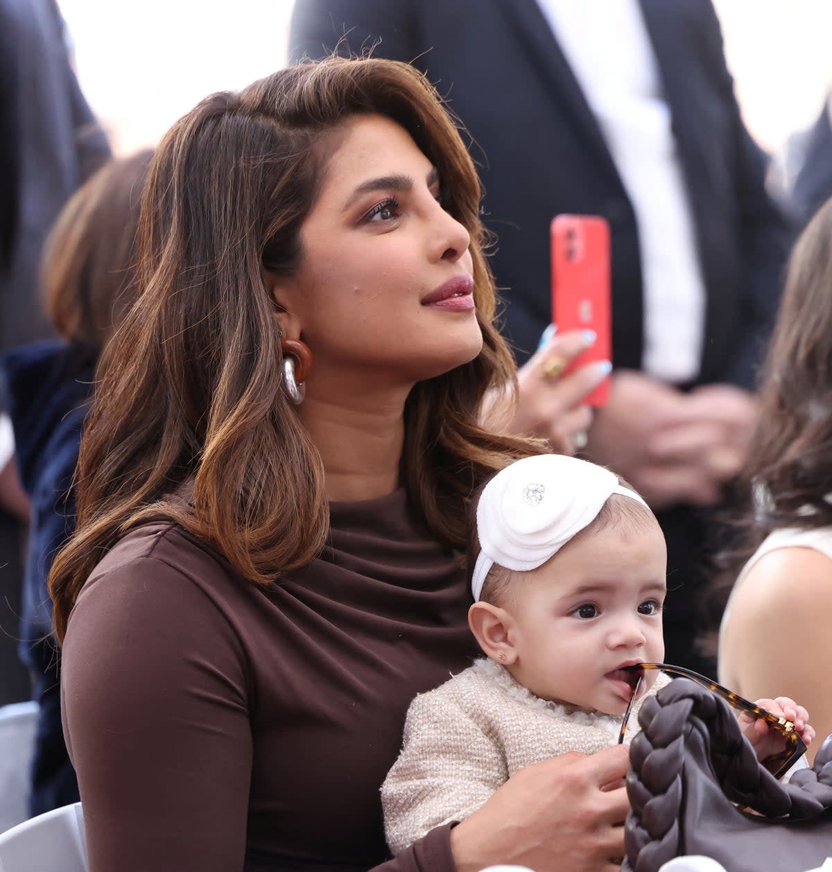 Priyanka Chopra holds her and Nick Jonas' daughter, Malti, during the ceremony where the Jonas Brothers will unveil their star on The Hollywood Walk of Fame in Los Angeles (REUTERS)