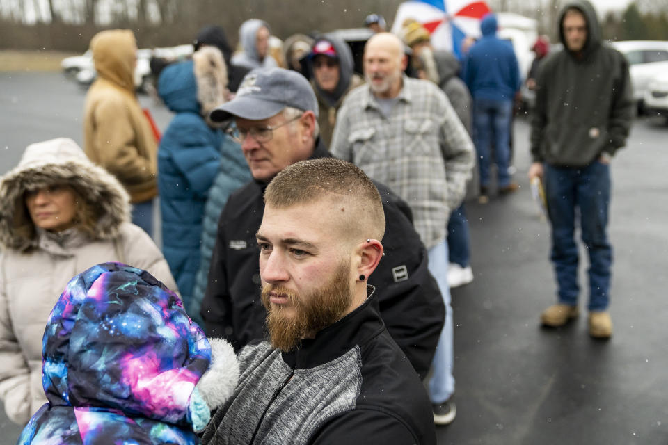 Residents wait in line at the Norfolk Southern Assistance Center to collect a $1000 check and get reimbursed for expenses while they were evacuated in East Palestine, Ohio (Michael Swensen / Getty Images)