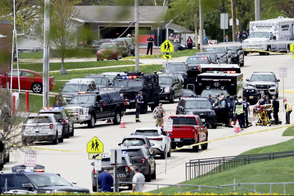 Law enforcement personnel respond to a report of a person armed with a rifle at Mount Horeb Middle School in Mount Horeb, Wis., Wednesday, May 1, 2024. The school district said a person it described as an active shooter was outside a middle school in Mount Horeb on Wednesday but the threat was “neutralized” and no one inside the building was injured. (John Hart/Wisconsin State Journal via AP)