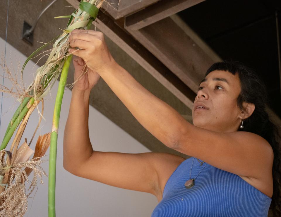 Los Angeles artist Maria Maea works on her installation for the Outburst Projects exhibition at the Palm Springs Art Museum in Palm Springs, Calif., on July 21, 2022.