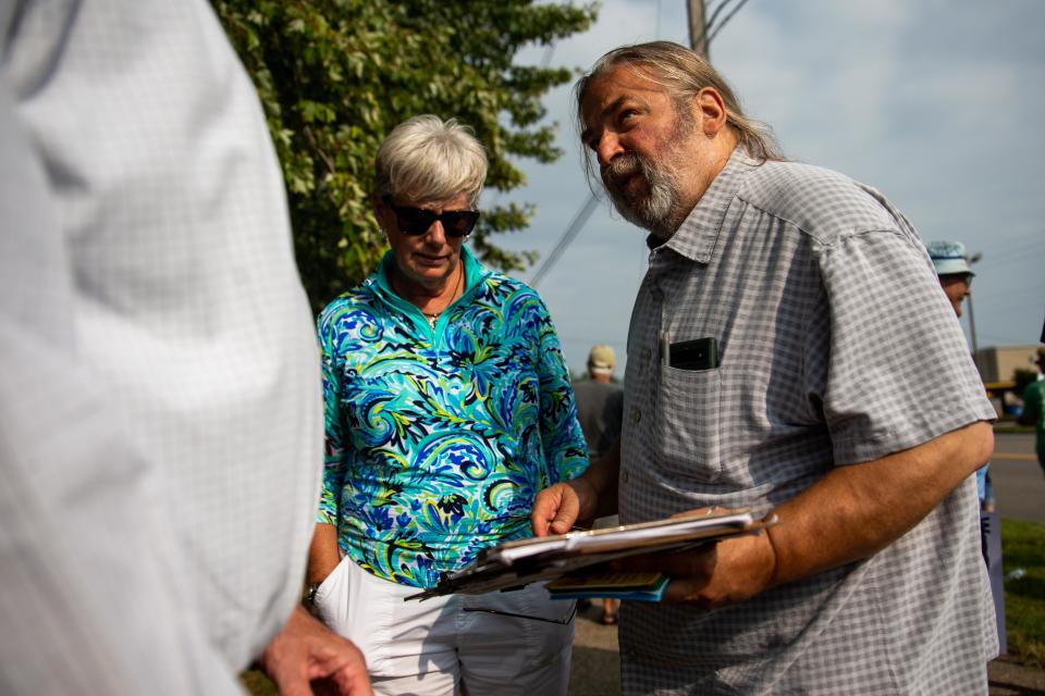 Bob Boersma speaks with voters about the petition to recall Lucy Ebel on Wednesday, Sept. 6, 2023, in Holland Township.