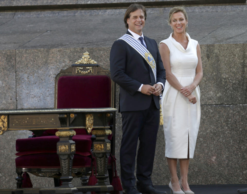 Uruguay's new President Luis Lacalle Pou and his wife Lorena Ponce de León smiles after his inauguration ceremony in Montevideo, Uruguay, Sunday, March 1, 2020. (AP Photo/Matilde Campodonico)