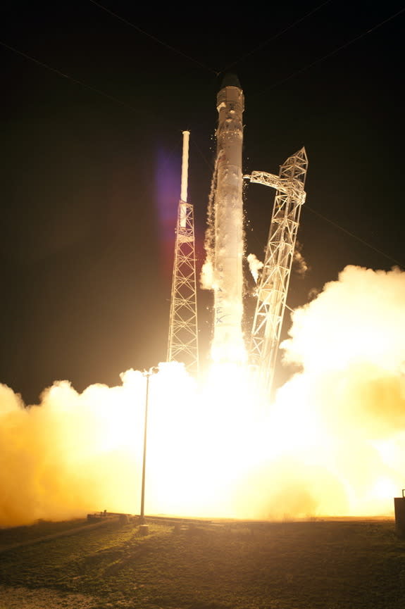 On Cape Canaveral Air Force Station in Florida, Space Launch Complex-40 is ablaze as the SpaceX Falcon 9 rocket lifts off at 3:44 a.m. EDT, May 22, 2012.